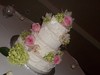 pink and green floral wedding cake catercornered