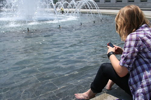 7/16/10 - Cooling off at the WWII Memorial - cell in hand at all times