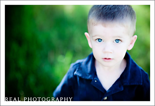 blue portrait backgrounds. lue eyed boy portrait outside