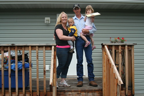 Ted and Kellie baker standing on the deck of their new home.  