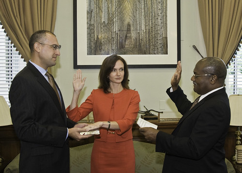 Dr. Elisabeth Hagen is sworn in to her new position as Under Secretary for Food Safety. Pearlie S. Reed, Assistant Secretary for Administration, swears her in as her husband, Dr. Daniel Gabbay, holds the Bible.
