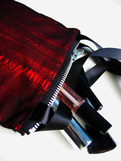 red laddered purse make-up shot
