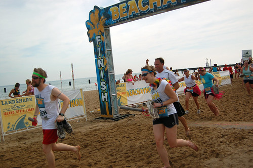 Fuzzy and Erica cross the Beachathon finish line, photo by Steve Delahoyde