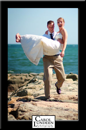Kevin Bardon carries Laura Shannon down the jetty at the Lighthouse Inn, Cape Cod