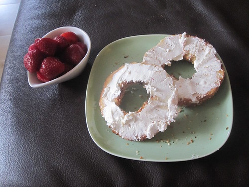 Bagel with cream cheese, strawberries
