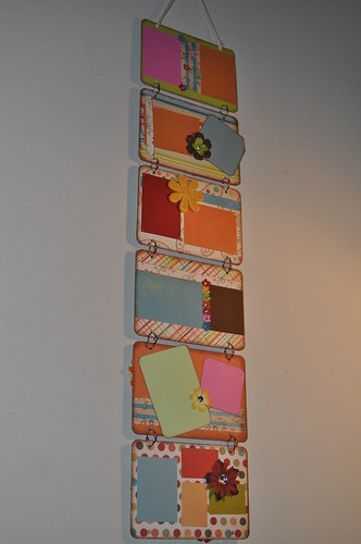 One side of my wall hanging, there are six panels all decorated in bright colors and there are spaces for pictures on each