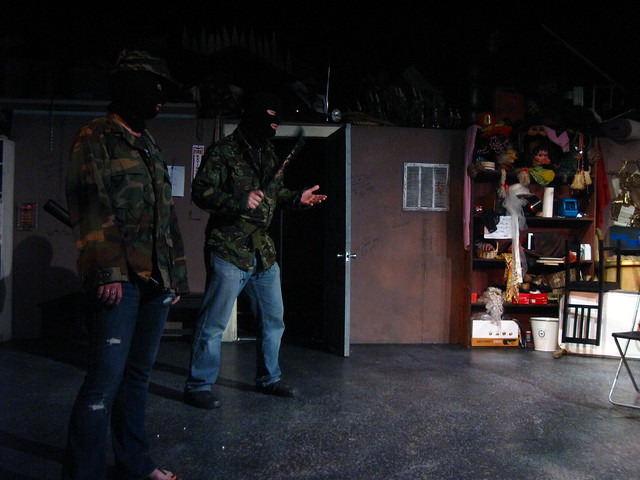 'What'd you say to me, unecessary ski cap?'  The goons (Mikaela Richmond & David Mayes) threaten the hipsters.