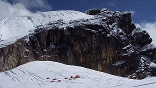 Base camp sits below a massif bearing one of the upper ice fields of the few remaining tropical glaciers. From story by NPR and picture credit: Courtesy of Paolo Gabrielli/Ohio State University