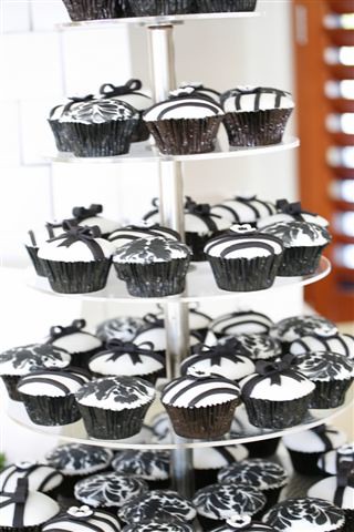 Our popular black and white wedding cupcake design black bows with tails 