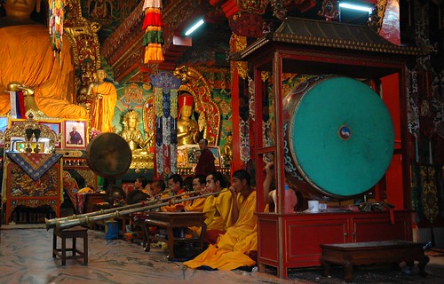 Tibetan Band playing, large drums, Buddha and bodhisattva statues, shrine room, Sakya Lamdre, Boudha, Kathmandu, Nepal by Wonderlane