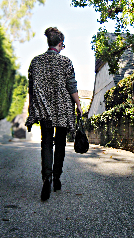 leopard dress as a jacket over jeans and a sweater