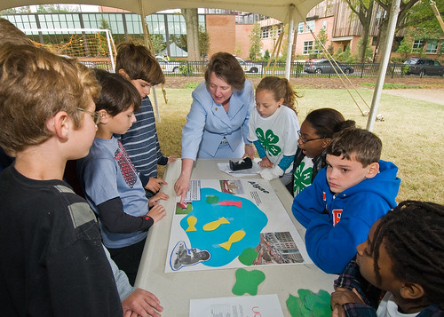Deputy Secretary Kathleen Merrigan and fifth grade student from Hearst Elementary School in Washington, DC,  discuss the effect of algae on water. The experiment was part of the 4-H National Youth Science Day, National Science Experiment, 4-H2O, Tuesday, October 6, 2010. Students learned about the importance of water quality and its impact on the environment with experiments to discover how to reduce their carbon footprint. USDA Photo 10di1518-14 by Bob Nichols.