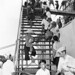 110 Each holding a package of rice and fish, Vietnamese refugees leave USS Bayfield (APA-33) at Saigon, Indochina, after a trip from Haiphong, September 1954 by manhhai