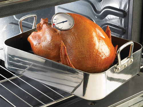 This Thanksgiving turkey has been heated to a safe minimum internal temperature of 165 °F, as indicated by the food thermometer. Bacteria is destroyed at this temperature, preventing foodborne illness. 