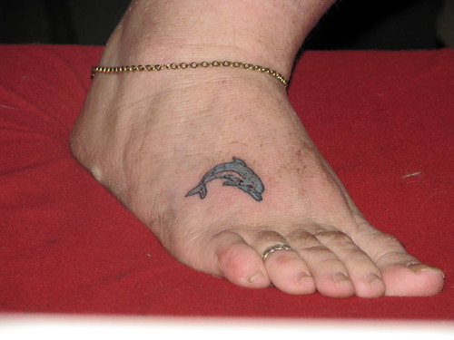 Cranky dolphin tattoo