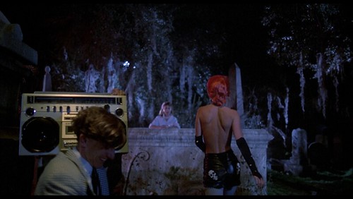  with the centerpiece of the party is Trash Linnea Quigley stripping 