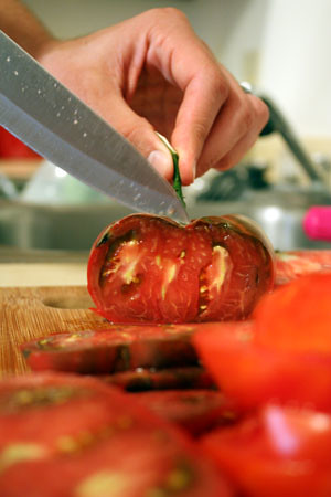 slicing tomatoes.