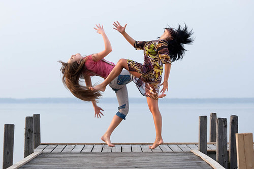 two girl are dancing on background of water and sky - Circus by friends