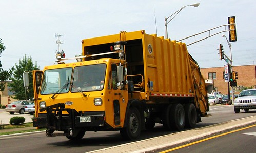 Eastbound yellow CCC garbage truck from the Skokie Public Works Refuse Collection Division. Skokie Illinois. July 2010. by Eddie from Chicago