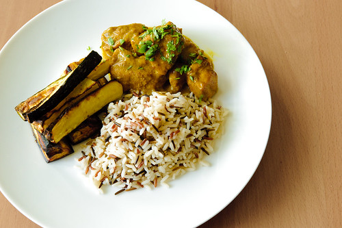 Pork curry, rice, roasted eggplant and courgette