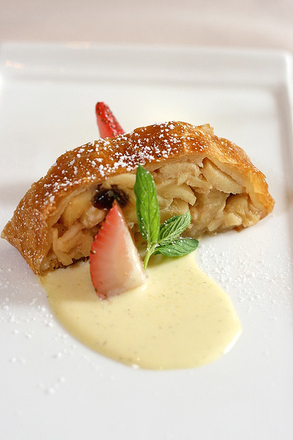Homemade Apple Strudel served with Hazelnuts and Warm Vanilla Sauce - by Warehouse Bistro