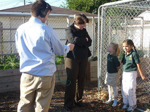 Deputy Secretary Merrigan listens as two students from the Academy of Global Citizenship explain what they feed their chickens and why.  