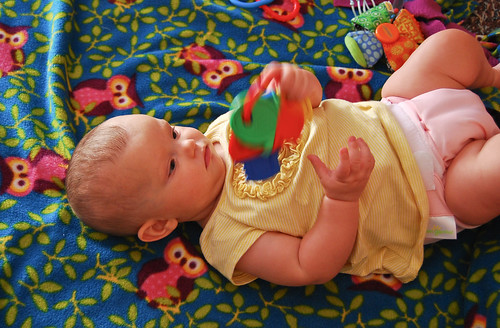 Maya playing on her new blanky
