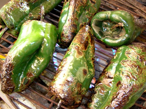 poblano chiles charring on the grill