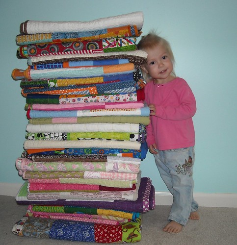 my girl with the KCMQG charity quilts