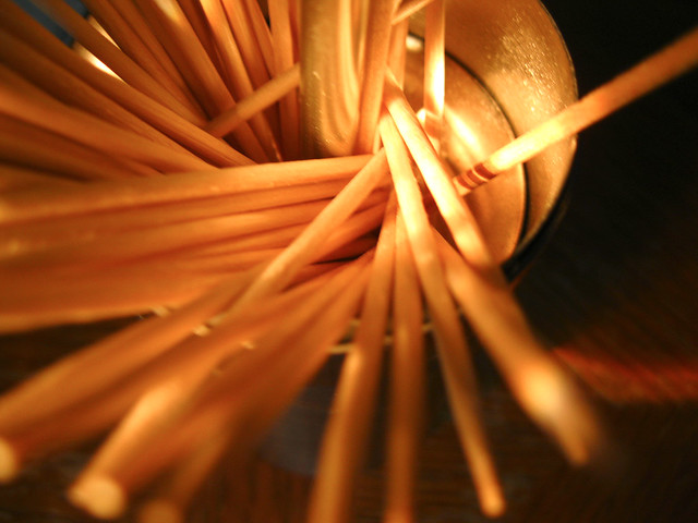toothpicks illuminated by flashlight