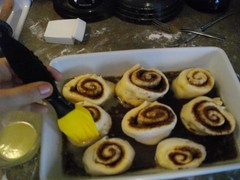 Painted melted butter onto the cinnamon buns