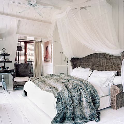 bedroom with fur+wicker bed