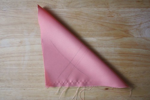 Step 2: Fold Fabric Square Diagonally, As Shown