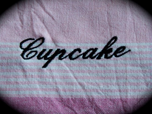 Cook a cupcake. A decorative tea towel.