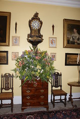 Clock, paintings & flower display