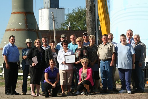 Community leaders from the Town of Ipswitch, South Dakota celebrate the construction of a new water tower. 