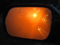 sunrise in the car mirror