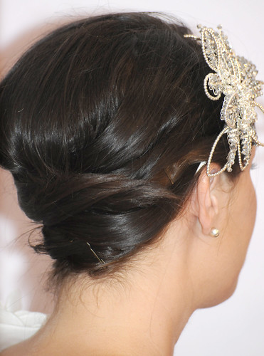 If you like romantic or a retro feel to your wedding this is a simple updo