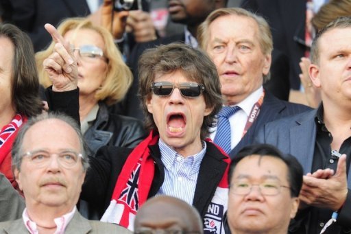 Thumb Mick Jagger from Rolling Stones watching the game England versus Germany