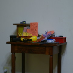 Still life with lamp, toys, and artworks