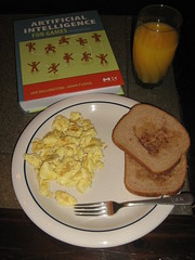 Scrambled eggs, buttered toast with cinnamon, and OJ