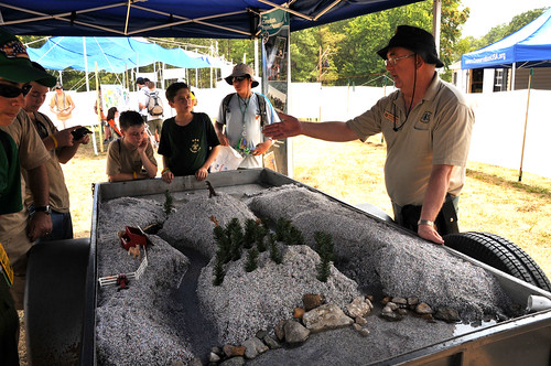 Denny Mattison, US Forest Service, tells scouts how water from sudden rains can damage ecosystems (USDA Forest Service photo by Jerry Snyder.