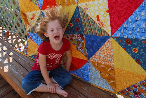 Girl and Quilt--did I mention windy?