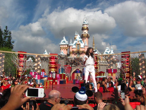 Selena Gomez performs in front of Sleeping Beauty Castle