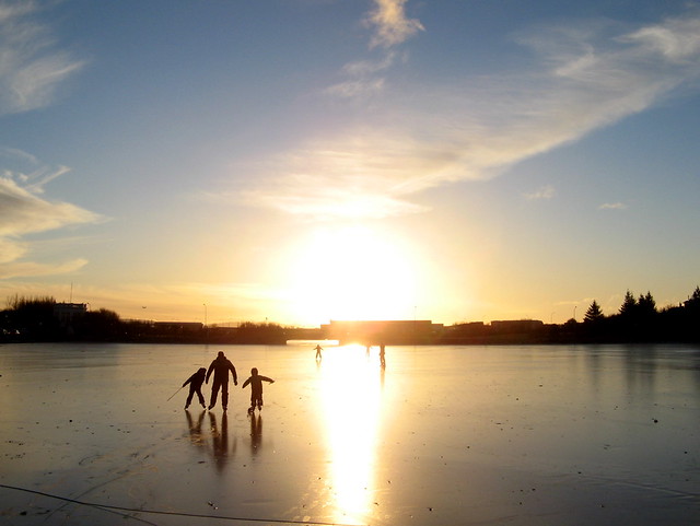 Skating on frozen Tjornin, Reykjavik