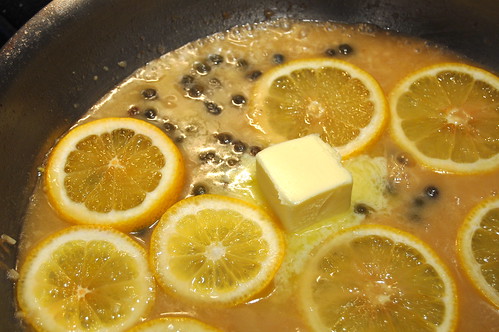 Add butter and lemon slices