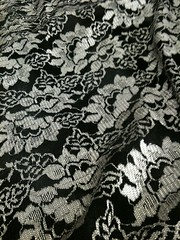 Silver lace, black satin