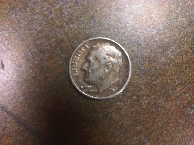 A silver dime, date 1951