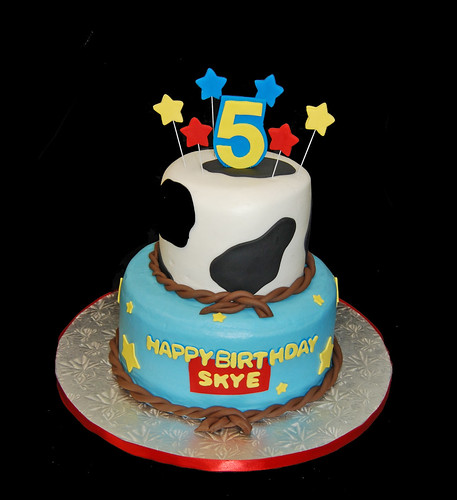 5th Birthday Cow print and stars 2 tiered cake for a Toy Story themed celebration