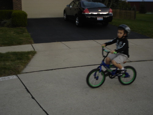 Mason riding his two wheeler